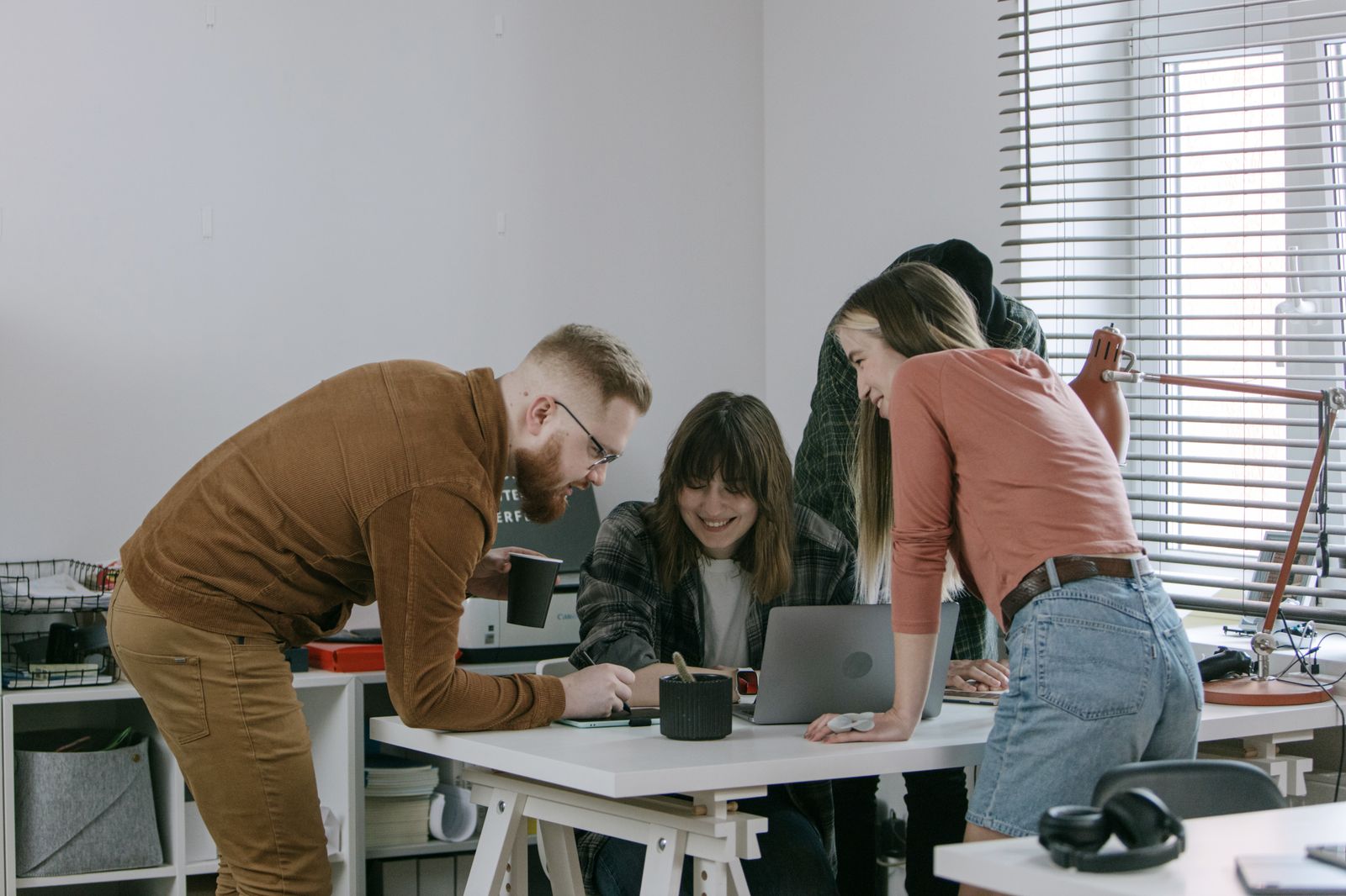 Small professional team collaborating around a work table